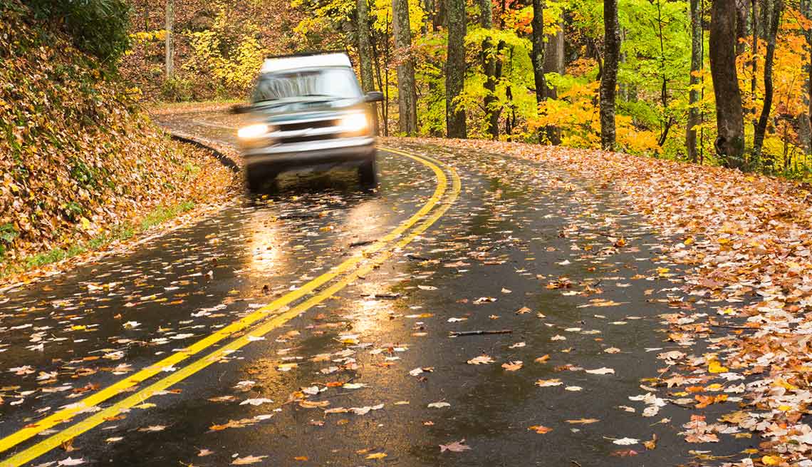 Toyota van driving through fall foliage the back roads of Northern Virginia.